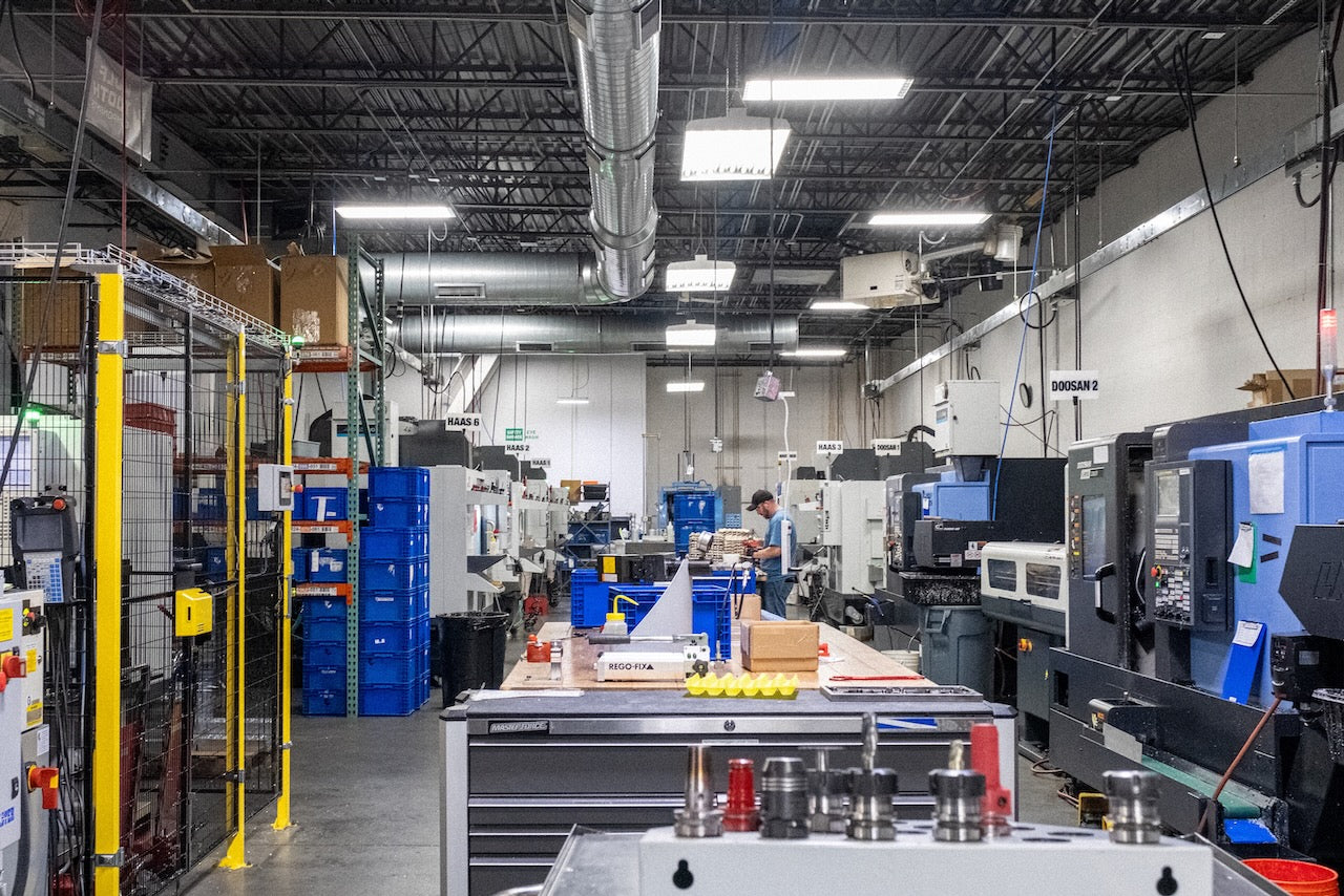 The Wolf Tooth machine shop filled with CNC mills and lathes.