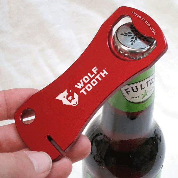 https://www.wolftoothcomponents.com/cdn/shop/products/WT-tool-bottle_opener-beer-red_590x.jpg?v=1702128591